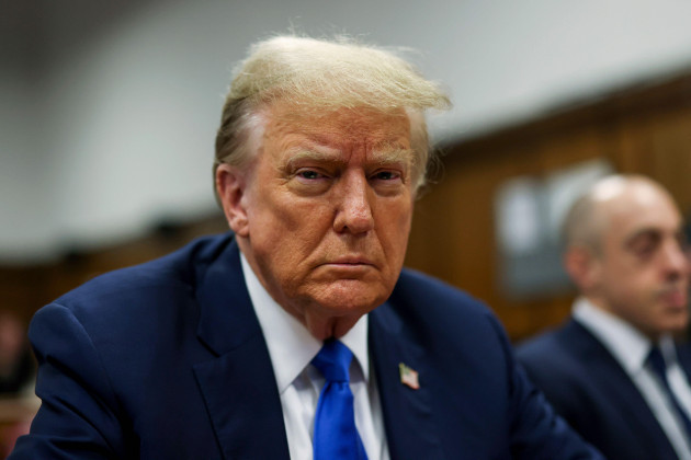 republican-presidential-candidate-and-former-president-donald-trump-sits-in-the-courtroom-at-his-criminal-trial-at-manhattan-state-court-in-new-york-monday-april-22-2024-brendan-mcdermidpool-pho