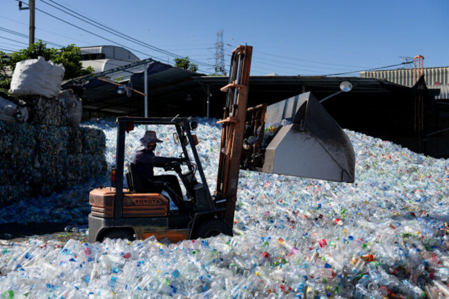 bang-phli-thailand-20th-dec-2023-a-worker-sorts-plastics-at-a-sorting-and-compacting-facility-in-bang-phli-samut-prakan-thailand-on-december-20-2023-thailand-is-one-of-the-worlds-biggest-poll