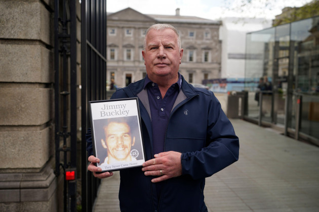 errol-buckley-holds-a-photo-of-his-brother-jimmy-buckley-who-died-in-the-fire-as-he-arrives-at-leinster-house-dublin-ahead-of-taoiseach-simon-harris-issuing-a-state-apology-to-the-families-of-the