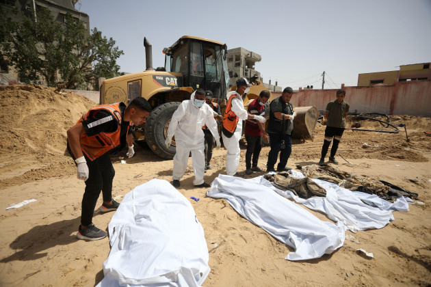 khan-younis-gaza-24th-apr-2024-civil-defense-teams-continue-to-remove-the-decomposed-and-dismembered-bodies-of-palestinians-who-lost-their-lives-after-israeli-attacks-in-khan-yunis-southern-gaza