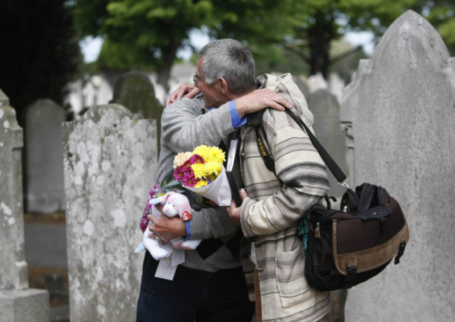 derek-leinster-left-and-patrick-anderson-mcquoid-former-residents-of-the-bethany-childrens-home-hug-at-a-service-to-launch-of-bethany-survivors-group-at-the-burial-site-of-children-from-the-home-in