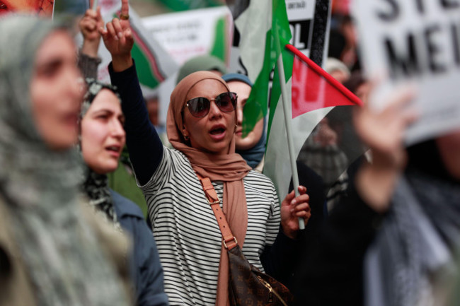 istanbul-turkey-23rd-apr-2024-an-arab-protester-holds-a-flag-as-she-chants-germany-the-killer-get-out-of-turkey-during-a-demonstration-in-front-of-the-german-embassy-in-istanbul-a-protest-is