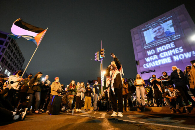 a-demonstrator-speaks-on-a-microphone-during-a-pro-palestinian-protest-over-the-israel-hamas-war-at-the-white-house-correspondents-association-dinner-saturday-april-27-2024-in-washington-ap-phot