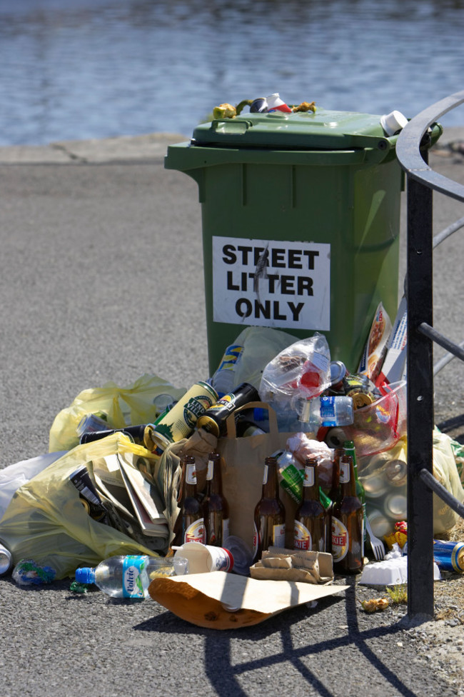 litter-piled-up-next-to-a-street-litter-only-green-wheelie-bin-by-a-fence-on-the-pier-galway-city