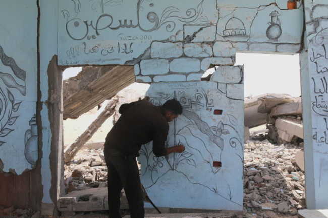 palestinian-artist-ghassan-habboub-who-took-refuge-in-rafah-city-due-to-israeli-attacks-draws-pictures-of-palestinian-flag-and-al-aqsa-mosque-symbolizing-the-solidarity-in-gaza-with-coal-on-the-wall