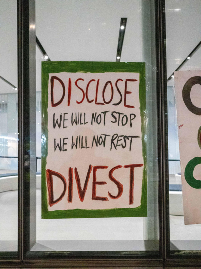 new-york-new-york-usa-1st-may-2024-disclose-divest-we-will-not-stop-we-will-not-rest-reads-on-a-poster-hung-at-an-nyu-building-a-few-hundred-students-rallied-for-palestine-at-new-york-unive