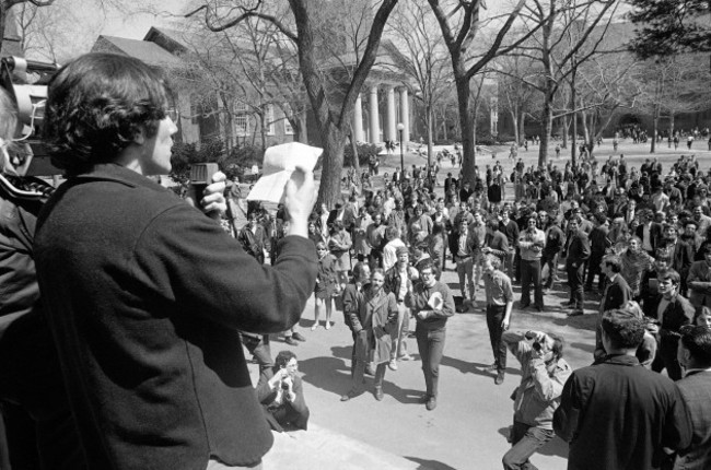 file-in-this-april-9-1969-file-picture-a-student-leader-speaks-from-steps-of-the-harvard-administration-building-at-cambridge-mass-as-part-of-a-protest-against-reserve-officers-training-corps-pr