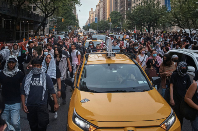 pro-palestinian-protesters-march-in-between-traffic-near-the-metropolitan-museum-of-art-where-the-met-gala-takes-place-monday-may-6-2024-in-new-york-ap-photoandres-kudacki