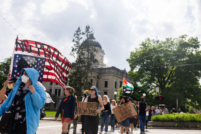 bloomington-united-states-07th-may-2024-bloomington-indiana-may-7-2024-pro-palestinian-protesters-march-in-response-to-israels-military-operations-in-rafah-in-gaza-in-downtown-bloomington