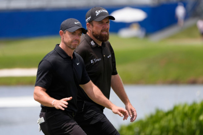rory-mcilroy-of-northern-ireland-acknowledges-the-crowd-as-he-walks-onto-the-ninth-green-with-teammate-shane-lowry-of-ireland-during-the-second-round-of-the-pga-zurich-classic-golf-tournament-at-t