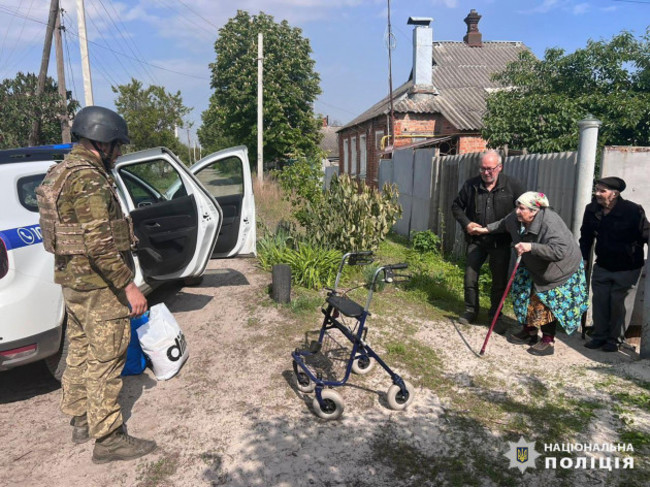 in-this-photo-provided-by-the-ukrainian-police-police-evacuate-elderly-people-following-the-russian-attack-around-the-town-of-vovchansk-in-kharkiv-region-ukraine-friday-may-10-2024-ukrainian-po