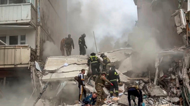 this-photo-released-by-belgorod-regional-governor-vyacheslav-gladkovs-telegram-channel-on-sunday-may-12-2024-russian-emergency-service-employees-work-at-the-scene-of-a-partially-collapsed-block-of