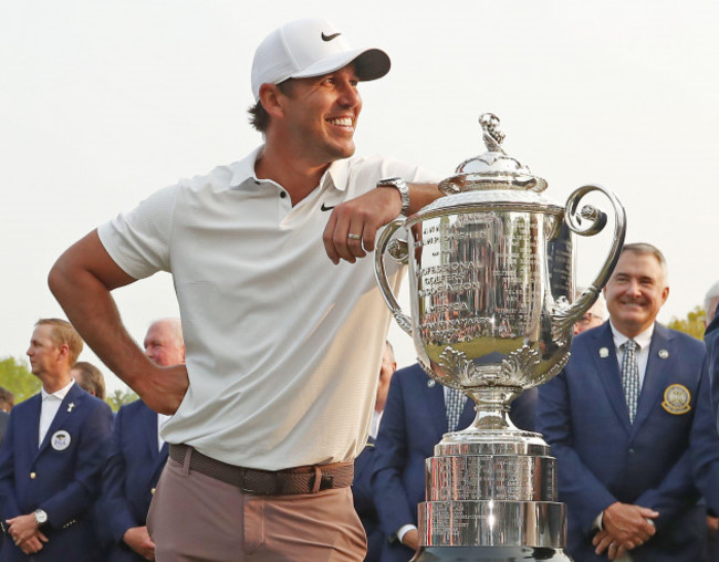 rochester-united-states-21st-may-2023-brooks-koepka-leans-on-the-trophy-after-winning-the-2023-pga-championship-at-oak-hill-country-club-in-rochester-new-york-on-sunday-may-21-2023-koepka-sho