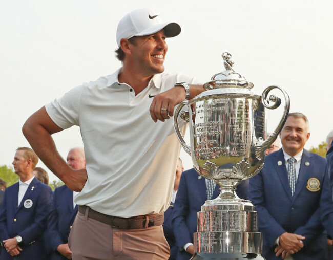 rochester-united-states-21st-may-2023-brooks-koepka-leans-on-the-trophy-after-winning-the-2023-pga-championship-at-oak-hill-country-club-in-rochester-new-york-on-sunday-may-21-2023-koepka-sho