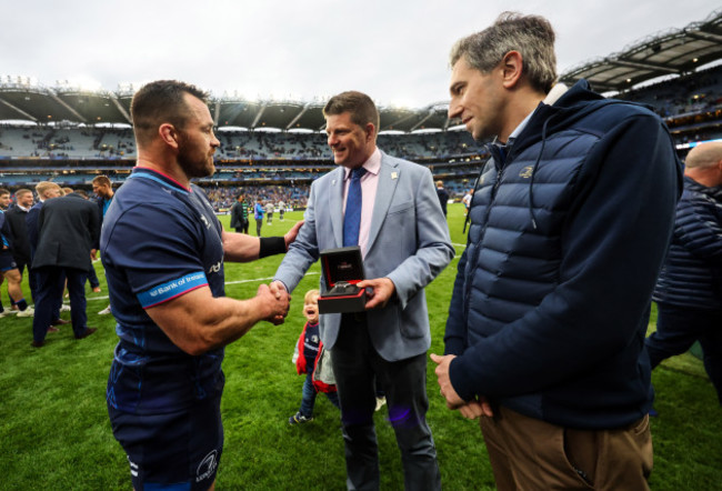 cian-healy-is-presented-with-an-award-from-dominic-mckay-and-simon-harris-after-making-the-most-champion-cup-appearances