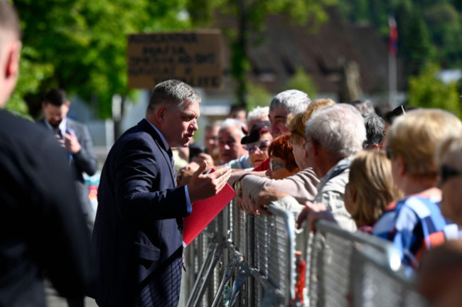 slovakias-prime-minister-robert-fico-centre-speaks-with-people-before-the-cabinets-away-from-home-session-in-the-town-of-handlova-slovakia-wednesday-may-15-2024-prime-minister-robert-fico-wa