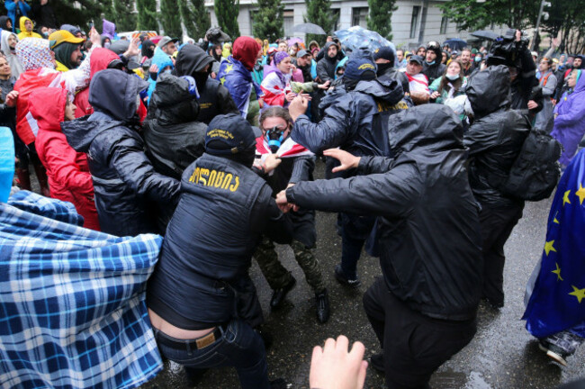 police-try-to-detain-demonstrators-near-the-parliament-building-during-an-opposition-protest-against-the-russian-law-in-the-center-of-tbilisi-georgia-on-monday-may-13-2024-daily-protests-are-co