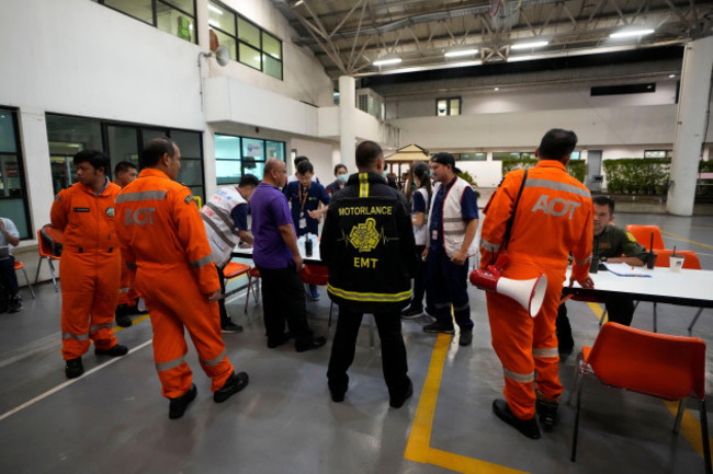 members-of-a-rescue-team-discuss-after-a-london-singapore-flight-was-diverted-to-bangkok-due-to-severe-turbulence-in-bangkok-thailand-tuesday-may-21-2024-the-plane-apparently-plummeted-for-a-num