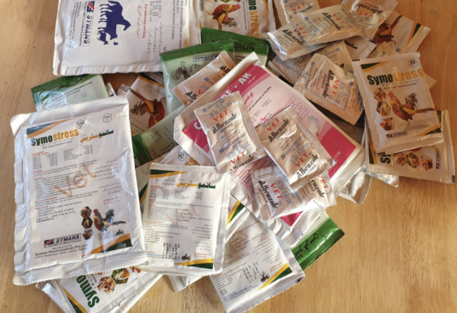 Large number of sachets from an image selling medication. 