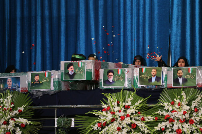 tehran-iran-21st-may-2024-a-picture-of-late-iranian-president-ebrahim-raisi-c-is-seen-on-a-casket-during-a-funeral-procession-ceremony-at-the-mossallah-mosque-in-tehran-raisi-was-confirmed-dead