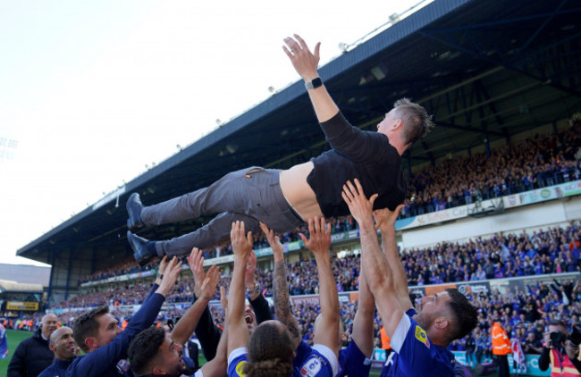 ipswich-town-manager-kieran-mckenna-is-thrown-into-the-air-by-the-players-as-they-celebrate-promotion-to-the-championship-on-the-pitch-after-the-sky-bet-league-one-match-at-portman-road-ipswich-pict