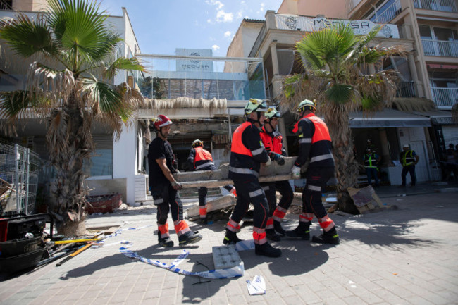 rubble-is-taken-away-from-a-collapsed-building-in-palma-de-mallorca-spain-friday-may-24-2024-spains-national-police-on-friday-gave-details-on-four-people-killed-when-a-building-housing-a-bar-and