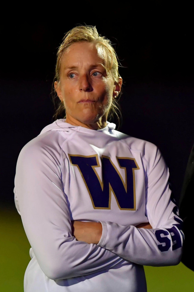 washington-huskies-associate-head-coach-amy-griffin-watches-her-team-warm-up-before-the-first-round-match-against-the-seattle-u-redhawks-during-the-ncaa-womens-division-1-soccer-tournament-on-novembe