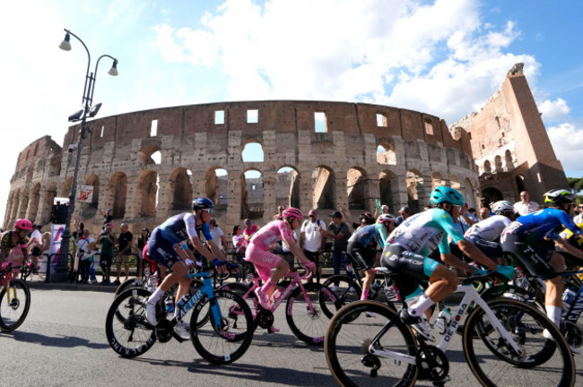 cyclists-including-the-pink-jersey-overall-leader-slovenias-tadej-pogacar-ride-past-the-ancient-colosseum-during-the-final-stage-of-the-giro-ditalia-cycling-race-in-rome-sunday-may-26-2024-ap