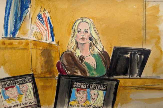 stormy-daniels-testifies-on-the-witness-stand-as-a-promotional-image-for-one-of-her-shows-featuring-an-image-of-trump-is-displayed-on-monitors-in-manhattan-criminal-court-thursday-may-9-2024-in-ne