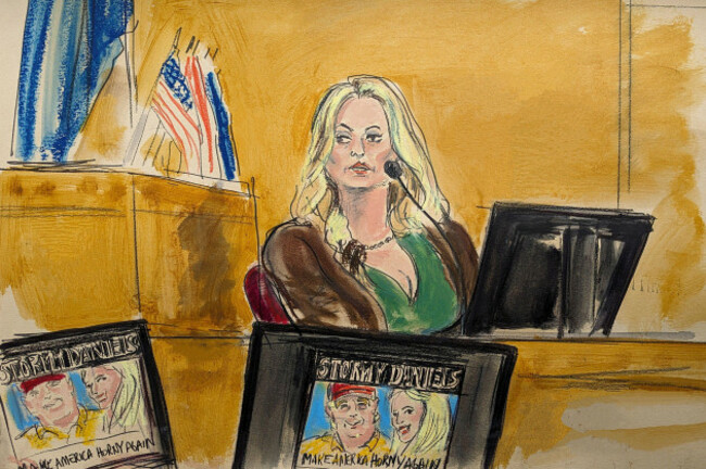 stormy-daniels-testifies-on-the-witness-stand-as-a-promotional-image-for-one-of-her-shows-featuring-an-image-of-trump-is-displayed-on-monitors-in-manhattan-criminal-court-thursday-may-9-2024-in-ne