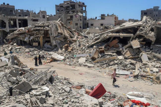 palestinians-walk-through-the-destruction-in-the-wake-of-an-israeli-air-and-ground-offensive-in-jebaliya-northern-gaza-strip-thursday-may-30-2024-ap-photoenas-rami