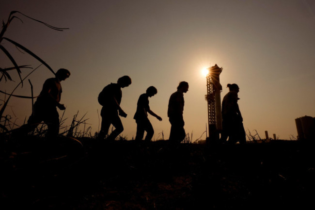 onlookers-watch-as-spacexs-mega-rocket-starship-is-prepared-for-a-test-flight-from-starbase-in-boca-chica-texas-wednesday-june-5-2024-ap-photoeric-gay