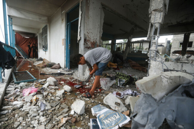 a-palestinian-looks-at-the-aftermath-of-the-israeli-strike-on-a-u-n-run-school-that-killed-dozens-of-people-in-the-nusseirat-refugee-camp-in-the-gaza-strip-thursday-june-6-2024-ap-photoismael-a