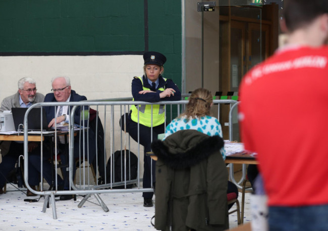 a-garda-keeping-watch-over-counting-staff-during-the-irish-general-election-count-at-the-nemo-rangers-gaa-club-in-cork-ireland