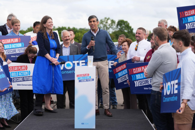 michelle-donelan-secretary-of-state-for-science-innovation-and-technology-listens-as-prime-minister-rishi-sunak-speaks-during-a-visit-to-melksham-town-football-club-while-on-the-general-election-ca