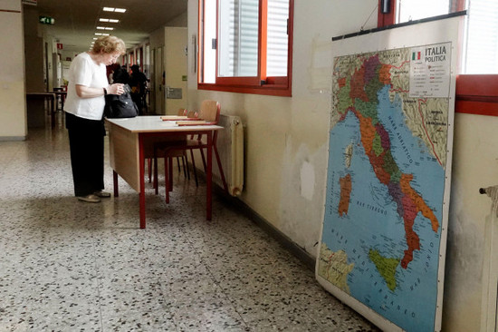 an-elderly-woman-checks-her-voting-paper-before-entering-a-polling-station-in-milan-italy-sunday-june-9-2024-tens-of-millions-across-the-european-union-were-voting-in-eu-parliamentary-elections-o