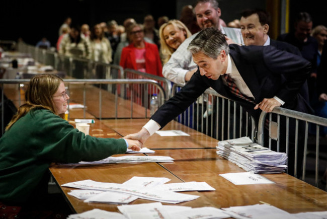 taoiseach-simon-harris-shakes-hands-with-a-teller-at-the-royal-dublin-society-during-the-count-for-the-european-elections-picture-date-sunday-june-9-2024