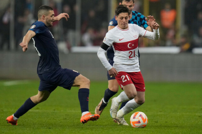 turkeys-arda-guler-is-challenged-by-croatias-mateo-kovacic-left-during-the-euro-2024-group-d-qualifying-soccer-match-between-turkey-and-croatia-at-bursa-metropolitan-stadium-in-bursa-turkey-tue