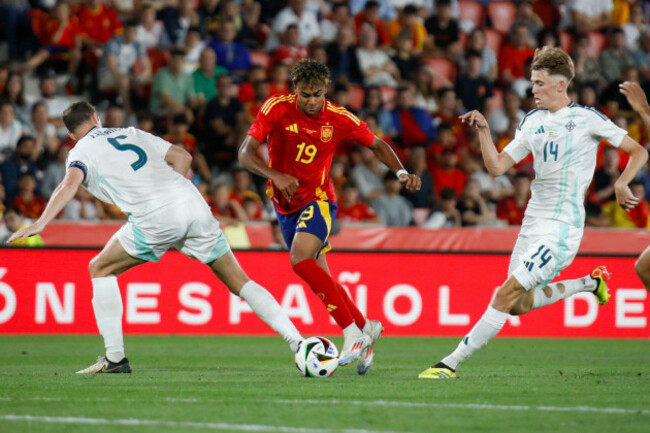 spains-lamine-yamal-center-is-challenged-by-northern-irelands-jonny-evans-left-during-the-international-friendly-soccer-match-between-spain-and-northern-ireland-at-the-son-moix-stadium-in-palma