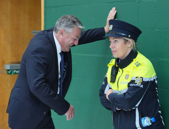 billy-kelleher-speaks-to-a-member-of-an-garda-siochana-as-he-arrives-at-nemo-rangers-gaa-club-in-cork-ireland-during-the-count-for-the-european-elections-picture-date-tuesday-june-11-2024