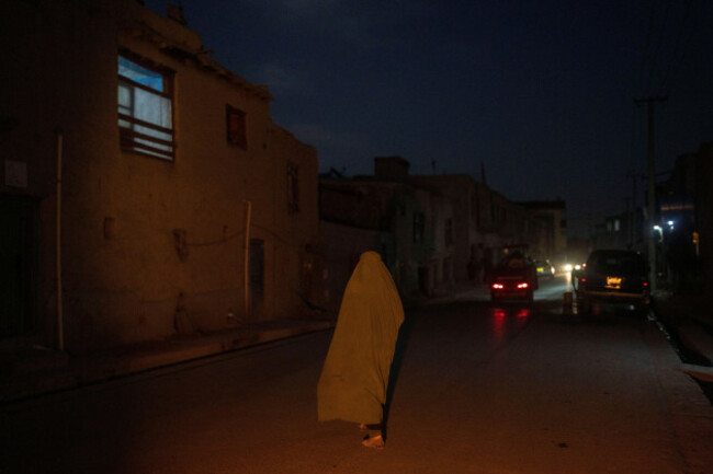a-woman-wearing-a-burka-walks-down-a-street-in-kabul-afghanistan-tuesday-nov-16-2021-ap-photopetros-giannakouris
