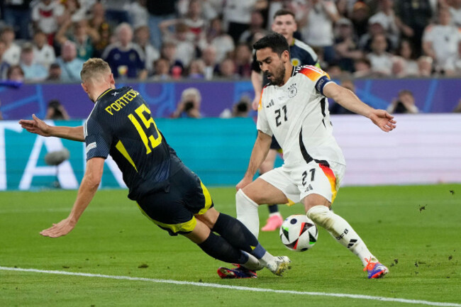 scotlands-ryan-porteous-left-fouls-germanys-ilkay-gundogan-to-give-away-a-penalty-during-a-group-a-match-between-germany-and-scotland-at-the-euro-2024-soccer-tournament-in-munich-germany-friday