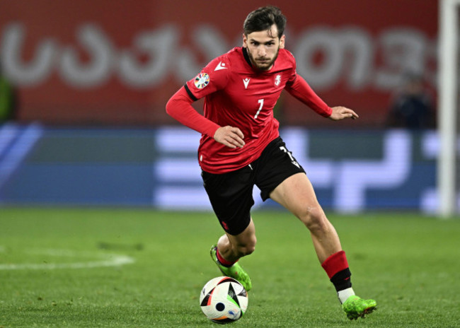 file-georgias-khvicha-kvaratskhelia-right-controls-the-ball-as-greeces-konstantinos-mavropanos-tries-to-stop-him-during-the-euro-2024-qualifying-play-off-soccer-match-between-georgia-and-greece