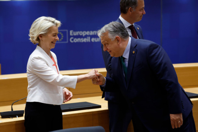 european-commission-president-ursula-von-der-leyen-left-is-greeted-by-hungarys-prime-minister-viktor-orban-during-a-round-table-meeting-at-an-eu-summit-in-brussels-monday-june-17-2024-the-27-le