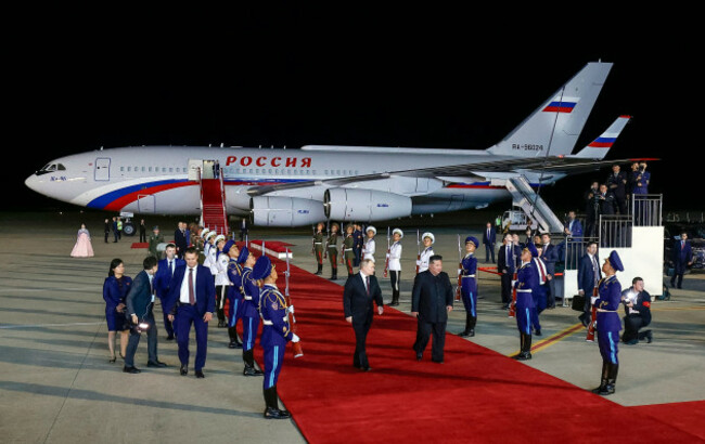 russian-president-vladimir-putin-center-left-and-north-koreas-leader-kim-jong-un-center-right-walk-together-during-their-meeting-at-the-pyongyang-sunan-international-airport-outside-pyongyang-no