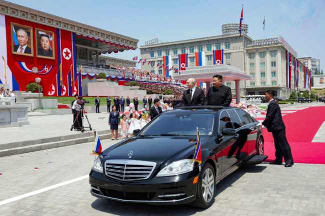russian-president-vladimir-putin-left-and-north-koreas-leader-kim-jong-un-right-arrive-to-attend-the-official-welcome-ceremony-in-the-kim-il-sung-square-in-pyongyang-north-korea-on-wednesday-j