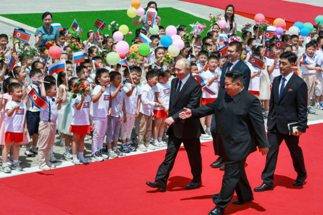 russian-president-vladimir-putin-left-and-north-koreas-leader-kim-jong-un-foreground-right-attend-the-official-welcome-ceremony-in-the-kim-il-sung-square-in-pyongyang-north-korea-on-wednesday