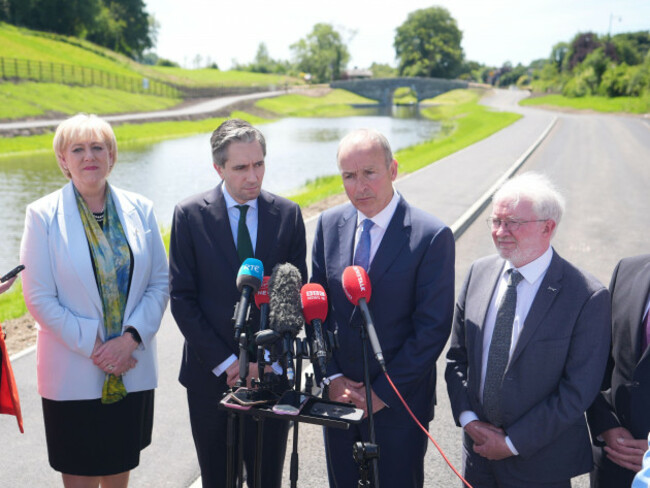 left-to-right-minister-for-rural-and-community-development-heather-humphreys-taoiseach-simon-harris-tanaiste-micheal-martin-and-the-green-partys-malcolm-noonan-speak-to-media-at-an-event-to-mark