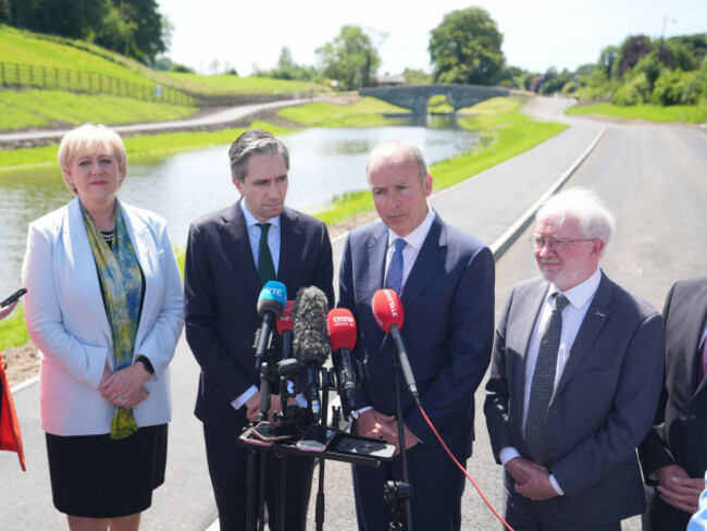 left-to-right-minister-for-rural-and-community-development-heather-humphreys-taoiseach-simon-harris-tanaiste-micheal-martin-and-the-green-partys-malcolm-noonan-speak-to-media-at-an-event-to-mark