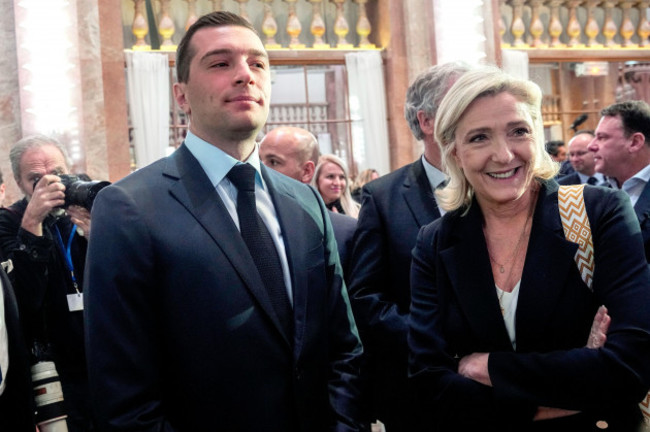 french-far-right-national-rally-party-president-jordan-bardella-stands-next-to-party-leader-marine-le-pen-after-the-new-years-speech-to-the-media-in-paris-monday-jan-15-2024-ap-photomichel-eul